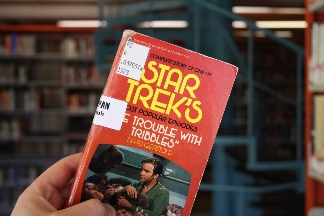 Photo of the Trouble with Tribbles cover in the library stacks.